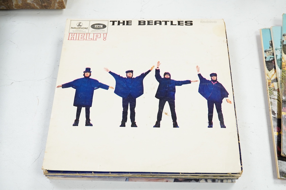 Fourteen LP record albums including eleven The Beatles and related; Sgt. Pepper’s Lonely Hearts Club Band (plus an additional three others), The Beatles at the Hollywood Bowl, Magical Mystery Tour, Revolver, etc., plus t